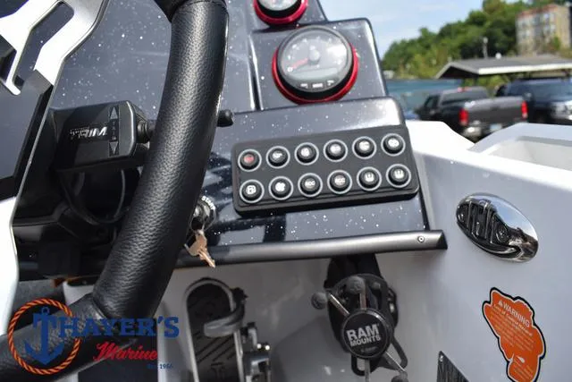Slide: The Image of Dashboard of 2025 Bass Cat Puma STS boat with steering wheel and control panel. - 41