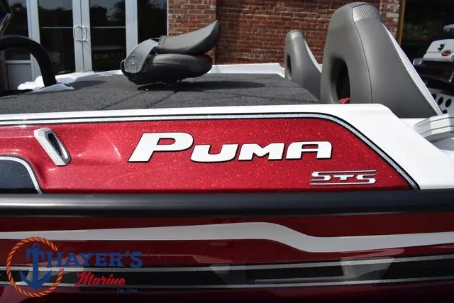 Slide: The Image of 2025 Bass Cat Puma STS boat with red detailing at Thayer's Marine. - 5