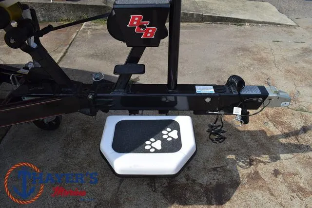 Slide: The Image of 2025 Bass Cat Puma STS trailer with paw print step detail. - 8