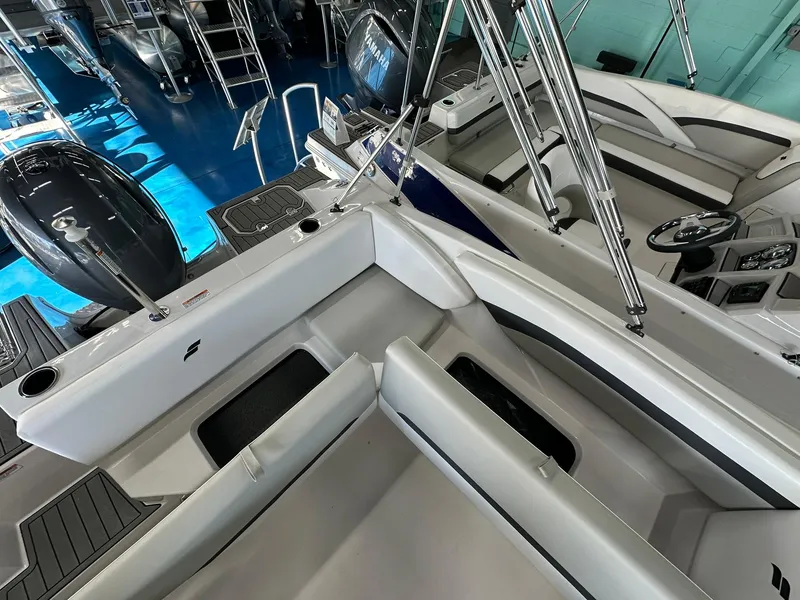 Slide: The Image of 2026 Starcraft SVX 171 OB boat interior with seating and storage compartment. - 11