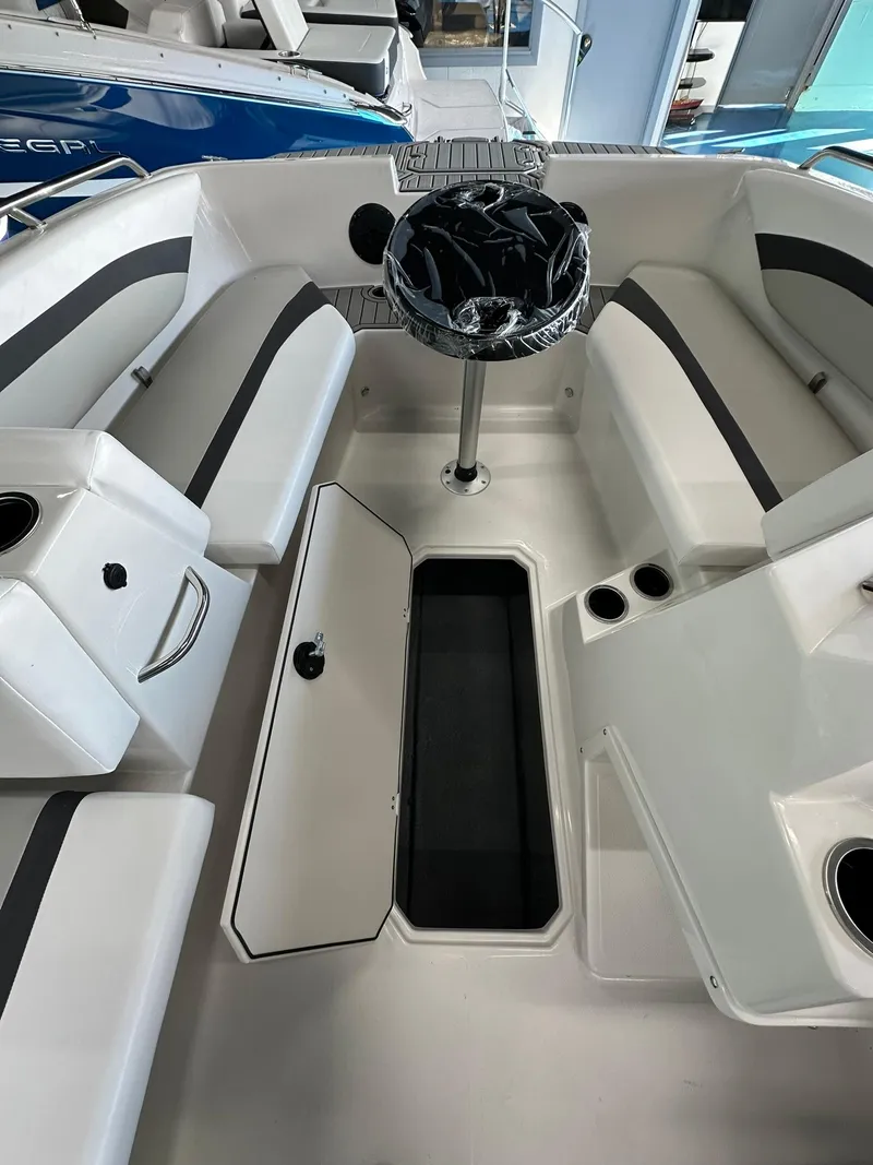 Slide: The Image of 2026 Starcraft SVX 171 OB boat dashboard with steering wheel and control panel. - 15