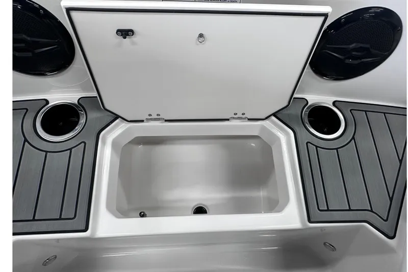 Slide: The Image of 2026 Starcraft SVX 171 OB boat storage compartment with cup holders and speakers. - 25