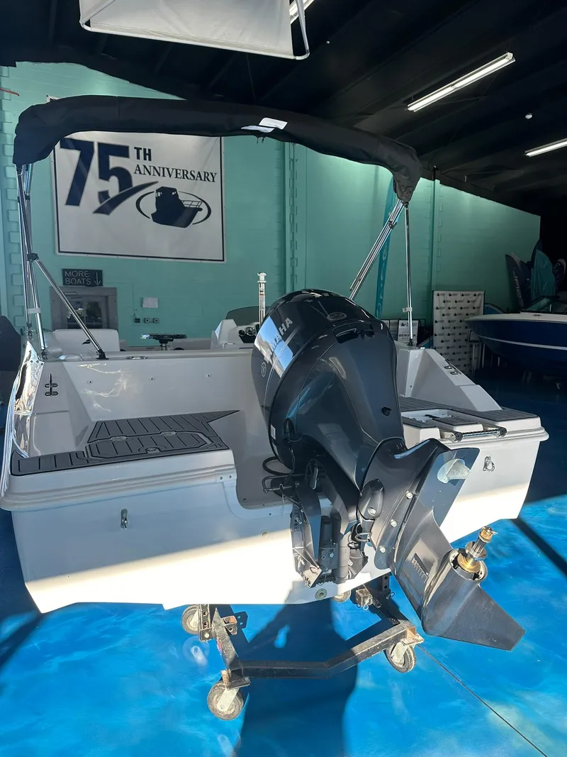 Slide: The Image of 2026 Starcraft SVX 171 OB boat with Yamaha outboard motor in showroom. - 6