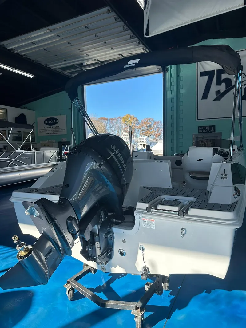 Slide: The Image of 2026 Starcraft SVX 171 OB boat with 115 HP engine displayed in showroom. - 7