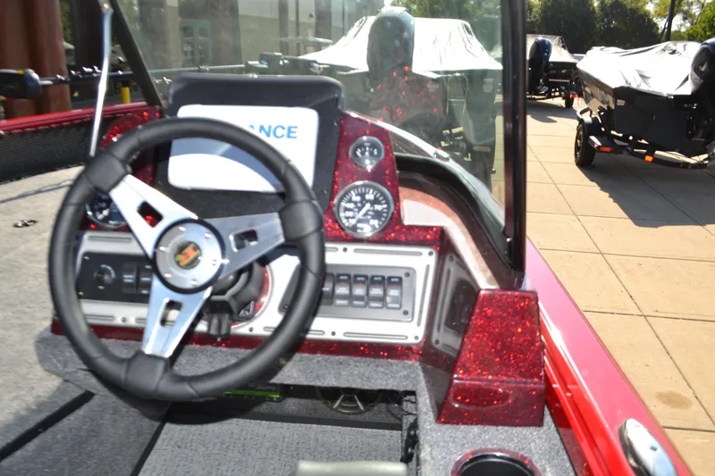 Slide: The Image of 2024 Ranger VS1782SC Angler boat dashboard with steering wheel and control panel. - 2