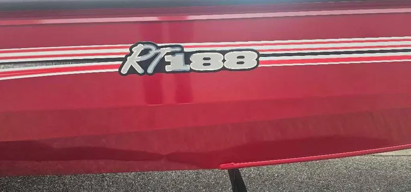 Slide: The Image of 2024 Ranger RT188 boat with red exterior and model branding. - 2