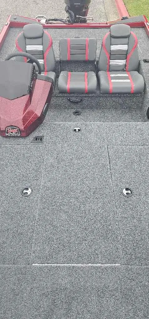 Slide: The Image of 2024 Ranger RT188 boat interior with gray and red seating. - 4
