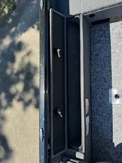 Slide: The Image of 2024 Ranger VS1665SC boat interior storage compartments. - 11