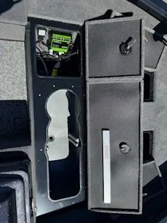 Slide: The Image of 2024 Ranger VS1665SC boat storage compartments with electronic equipment. - 13