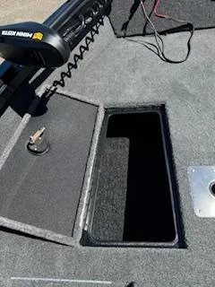 Slide: The Image of 2024 Ranger VS1665SC boat deck with storage compartment and fishing equipment. - 3