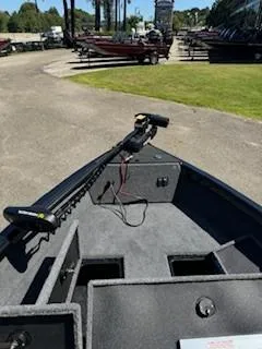 Slide: The Image of 2024 Ranger VS1665SC boat with trolling motor, parked outdoors. - 4