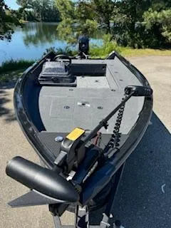 Slide: The Image of 2024 Ranger VS1665SC fishing boat on a sunny lakeside. - 5