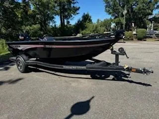 Slide: The Image of 2024 Ranger VS1665SC boat on trailer in sunny outdoor setting. - 7