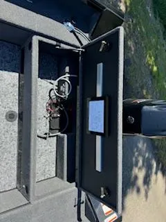 Slide: The Image of 2024 Ranger VS1665SC boat storage compartment with wiring and equipment. - 9