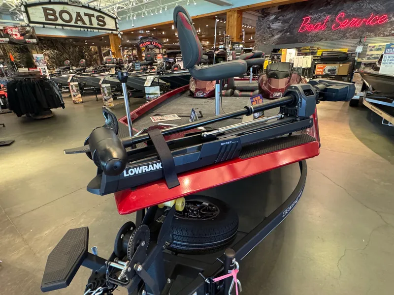 Slide: The Image of 2024 Ranger RT188P boat displayed in showroom with Lowrance equipment. - 2