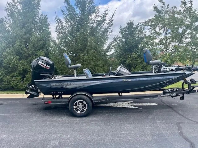 Slide: The Image of 2024 Ranger RT178 fishing boat on trailer, parked outdoors. - 0