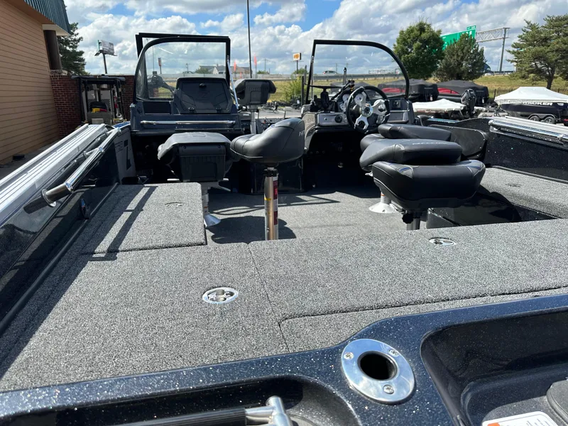 Slide: The Image of 2024 Nitro ZV20 Pro fishing boat interior with seating and steering console. - 2