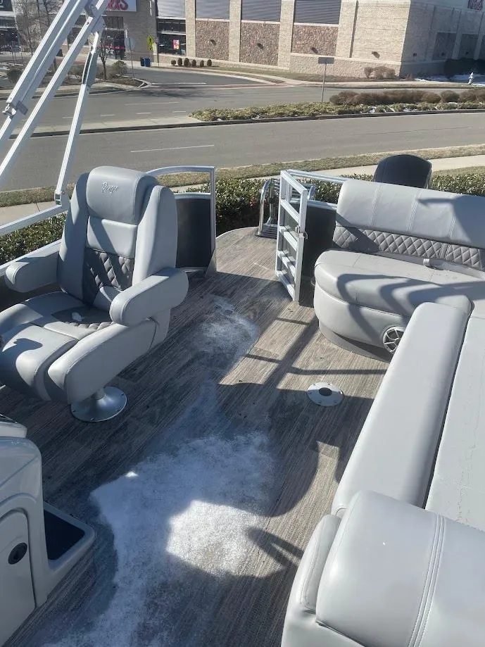 Slide: The Image of 2024 Ranger Reata 223C boat interior with plush seating and modern design. - 3