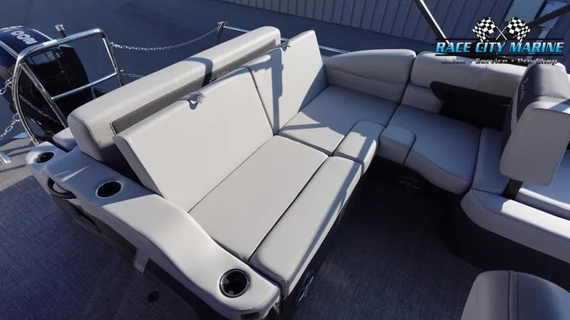Slide: The Image of 2025 Barletta Cabrio 22U boat interior with plush seating and cup holders. - 15