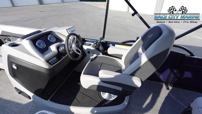 Slide: The Image of 2025 Barletta Cabrio 22U boat interior with modern dashboard and comfortable seating. - 21