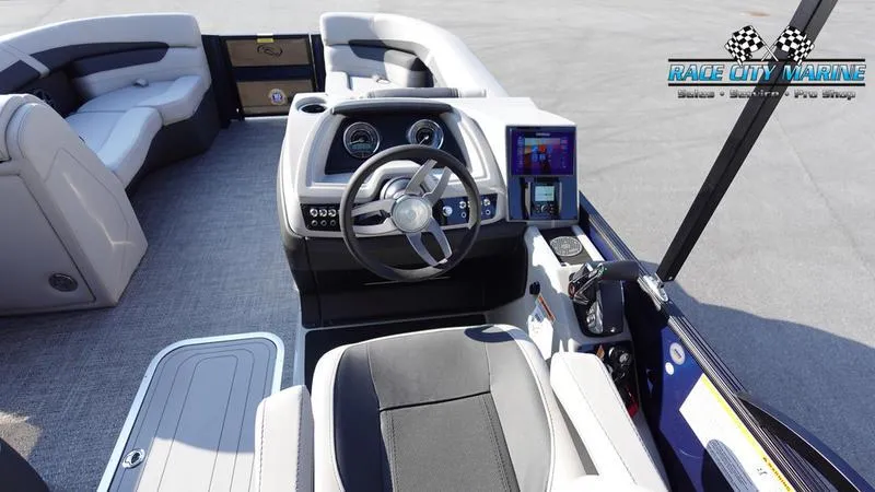 Slide: The Image of 2025 Barletta Cabrio 22U boat interior with modern dashboard and seating. - 22