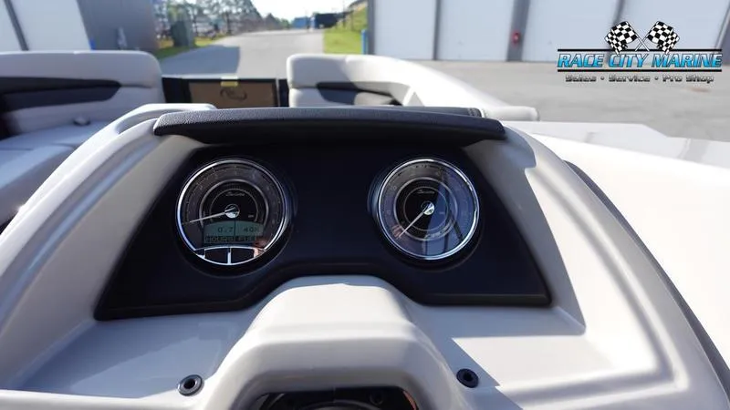 Slide: The Image of 2025 Barletta Cabrio 22U dashboard with dual gauges, Race City Marine logo. - 23
