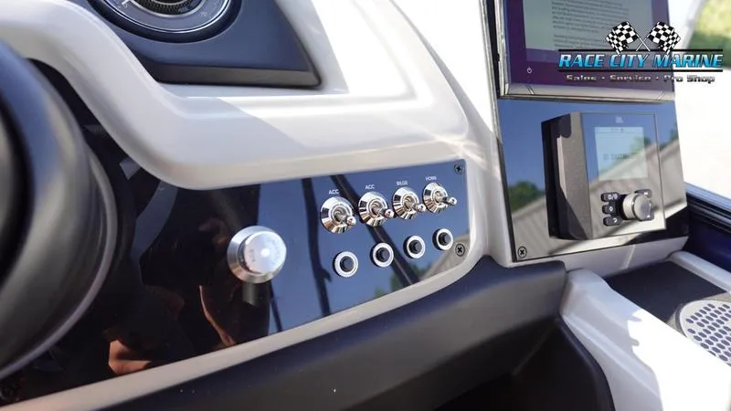 Slide: The Image of Control panel of 2025 Barletta Cabrio 22U boat with switches and display. - 26