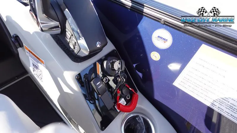 Slide: The Image of 2025 Barletta Cabrio 22U boat dashboard with controls and ignition keys. - 27