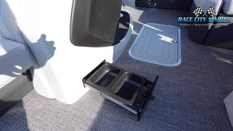 Slide: The Image of 2025 Barletta Cabrio 22U interior with retractable cup holders and carpeted flooring. - 35