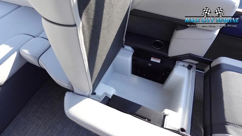 Slide: The Image of 2025 Barletta Cabrio 22U boat interior storage compartment with cushioned seating. - 43