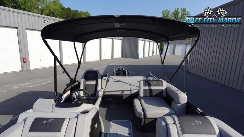 Slide: The Image of 2025 Barletta Cabrio 22U pontoon boat with canopy in storage facility. - 44