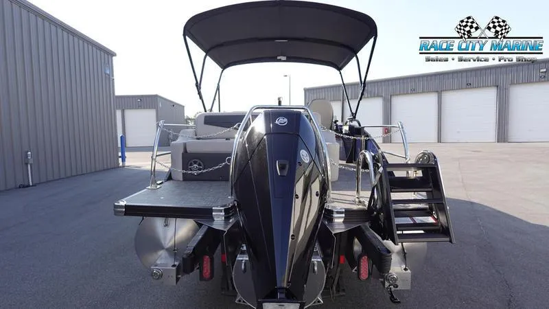 Slide: The Image of 2025 Barletta Cabrio 22U pontoon boat with outboard motor, docked at Race City Marine. - 5