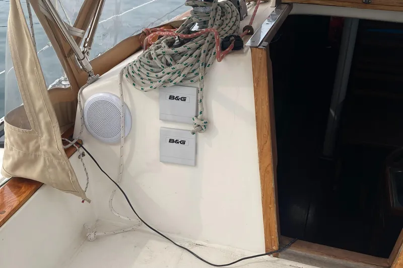 Slide: The Image of 1981 Sabre 34 sailboat cockpit with B&G instruments and coiled ropes. - 12