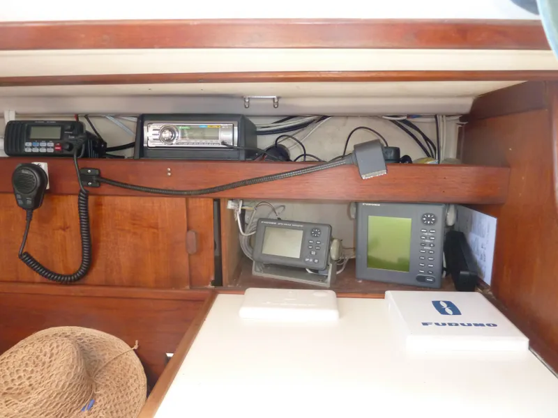 Slide: The Image of Navigation equipment inside a 1981 Sabre 34 sailboat cabin. - 16