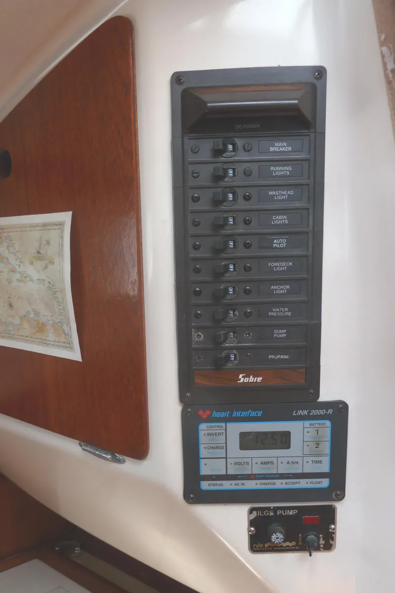 Slide: The Image of Electrical panel on 1981 Sabre 34 sailboat, featuring switches and navigation equipment. - 18