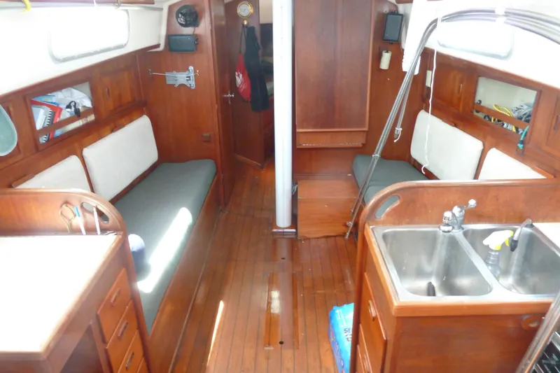 Slide: The Image of Interior of 1981 Sabre 34 sailboat with wooden finish and compact kitchen area. - 19