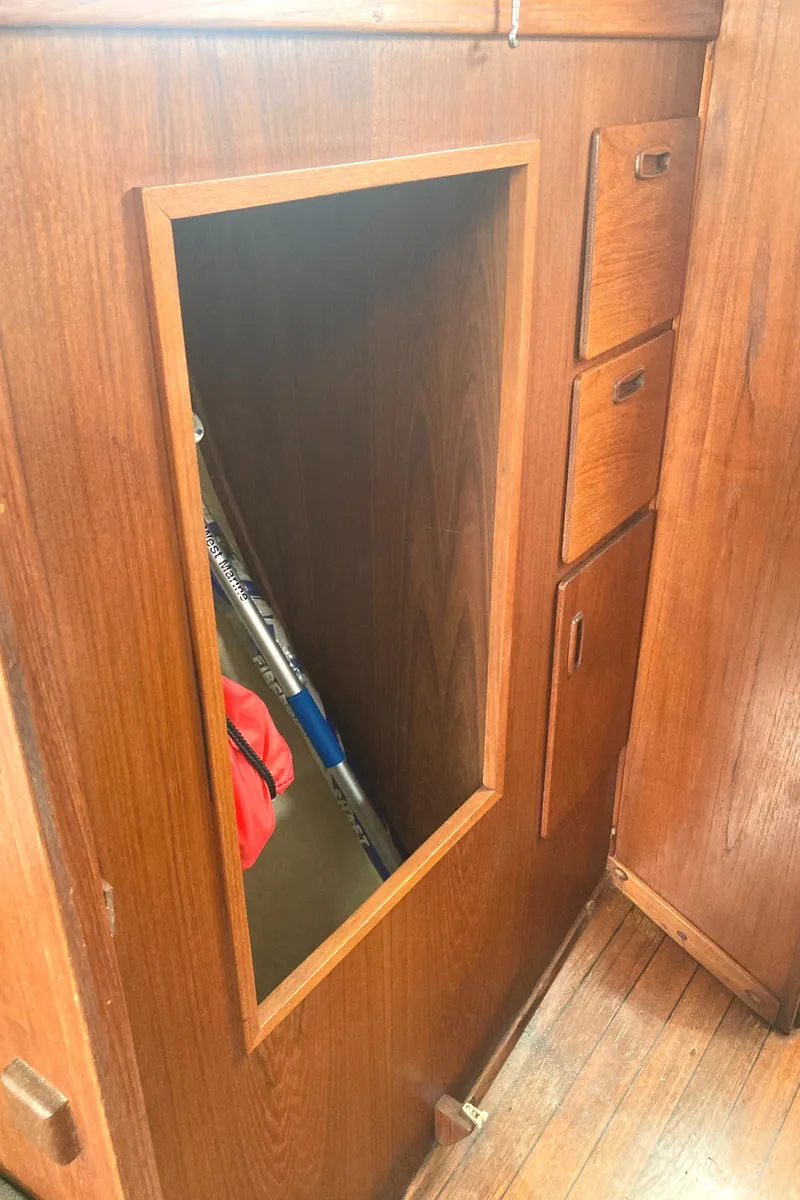 Slide: The Image of Wooden interior of 1981 Sabre 34 sailboat with storage compartment and drawers. - 21