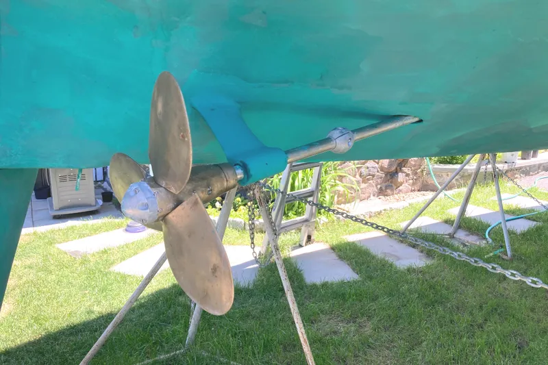 Slide: The Image of 1981 Sabre 34 sailboat propeller and shaft on display outdoors. - 3