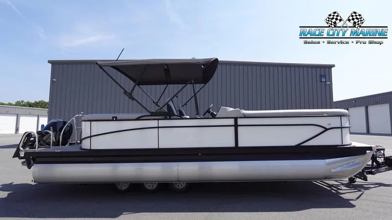 The Image of 2025 Barletta C24QC pontoon boat at Race City Marine dealership. - 0