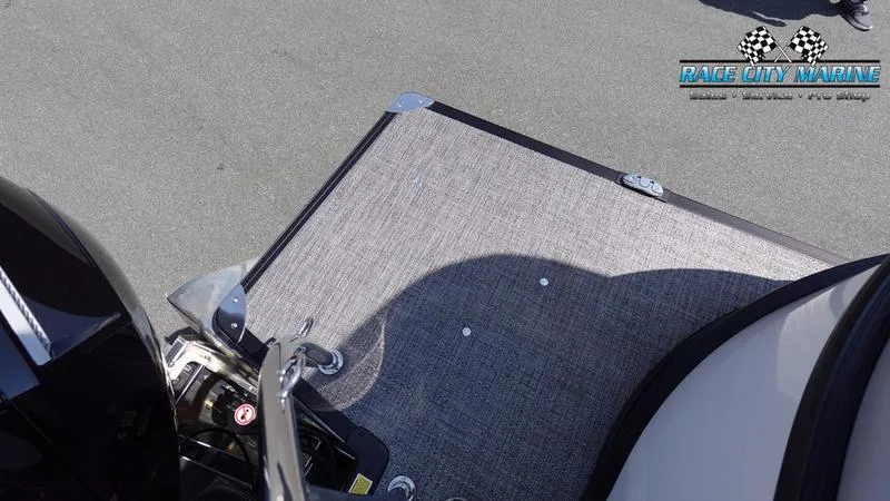 Slide: The Image of 2025 Barletta C24QC boat deck with Race City Marine logo. - 10