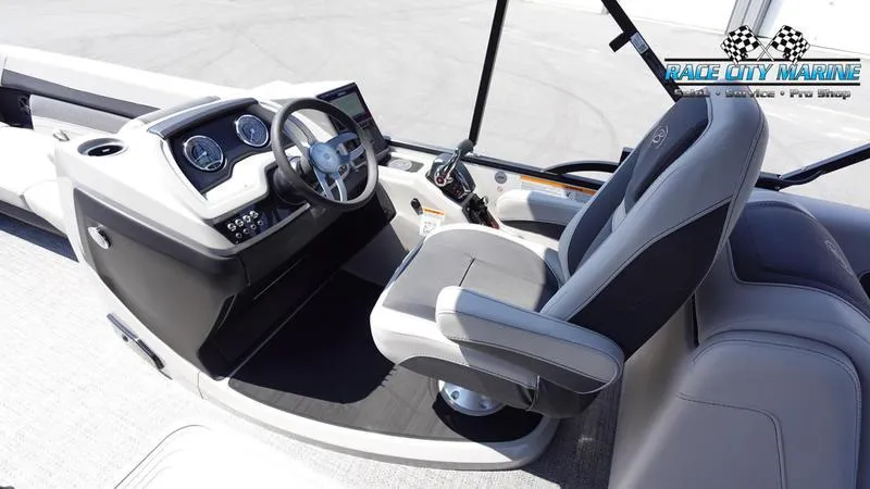 Slide: The Image of 2025 Barletta C24QC boat interior with modern helm and comfortable captain's chair. - 11