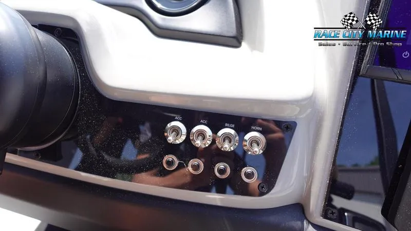 Slide: The Image of Control panel of 2025 Barletta C24QC boat with labeled switches. - 19