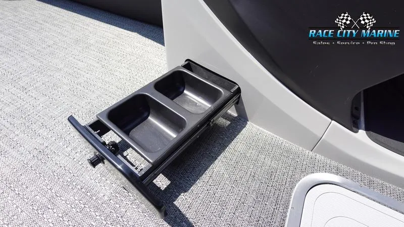 Slide: The Image of Barletta C24QC 2025 boat with built-in cup holders on textured flooring. - 21