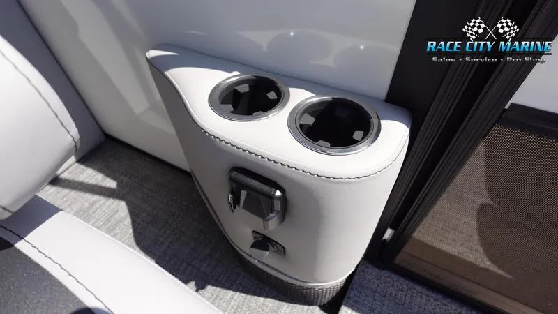 Slide: The Image of Barletta C24QC 2025 boat interior with cup holders and Race City Marine logo. - 22