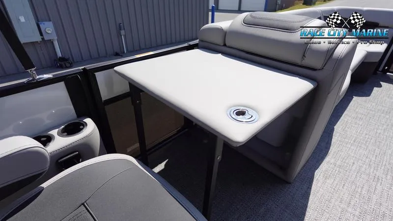 Slide: The Image of 2025 Barletta C24QC boat interior with seating and table. - 26