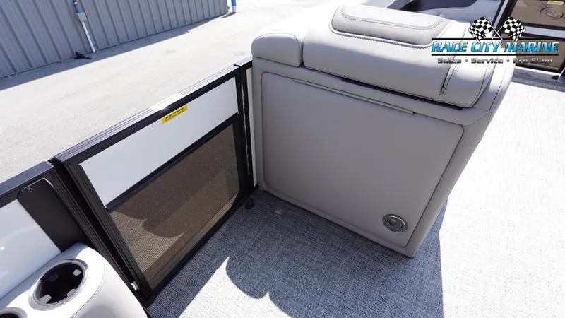 Slide: The Image of 2025 Barletta C24QC boat interior with gray seating and storage compartment. - 27