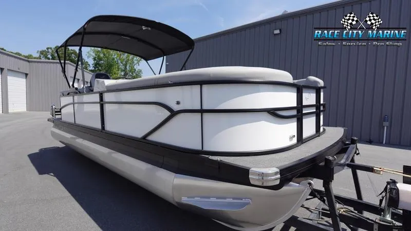 Slide: The Image of 2025 Barletta C24QC pontoon boat at Race City Marine dealership. - 3