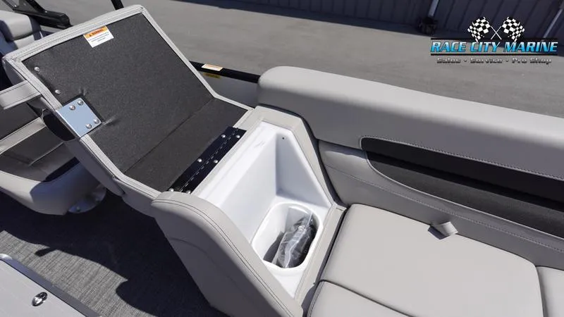 Slide: The Image of 2025 Barletta C24QC boat interior with open storage compartment and seating. - 30