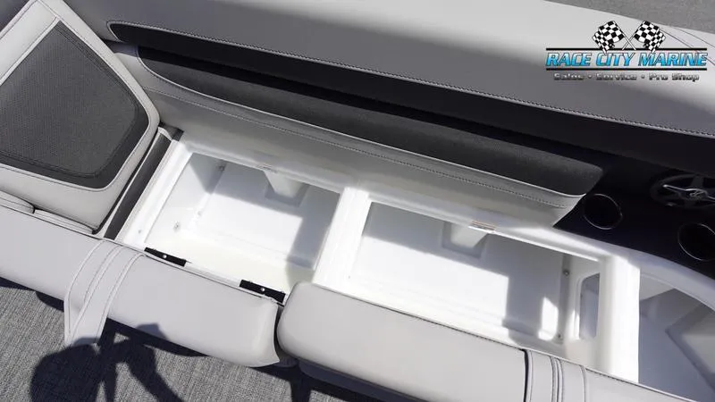 Slide: The Image of Barletta C24QC 2025 boat interior storage compartment with cushioned seating. - 31