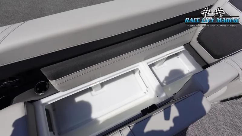 Slide: The Image of Barletta C24QC 2025 boat interior storage compartment with open lid, showcasing spacious design. - 33